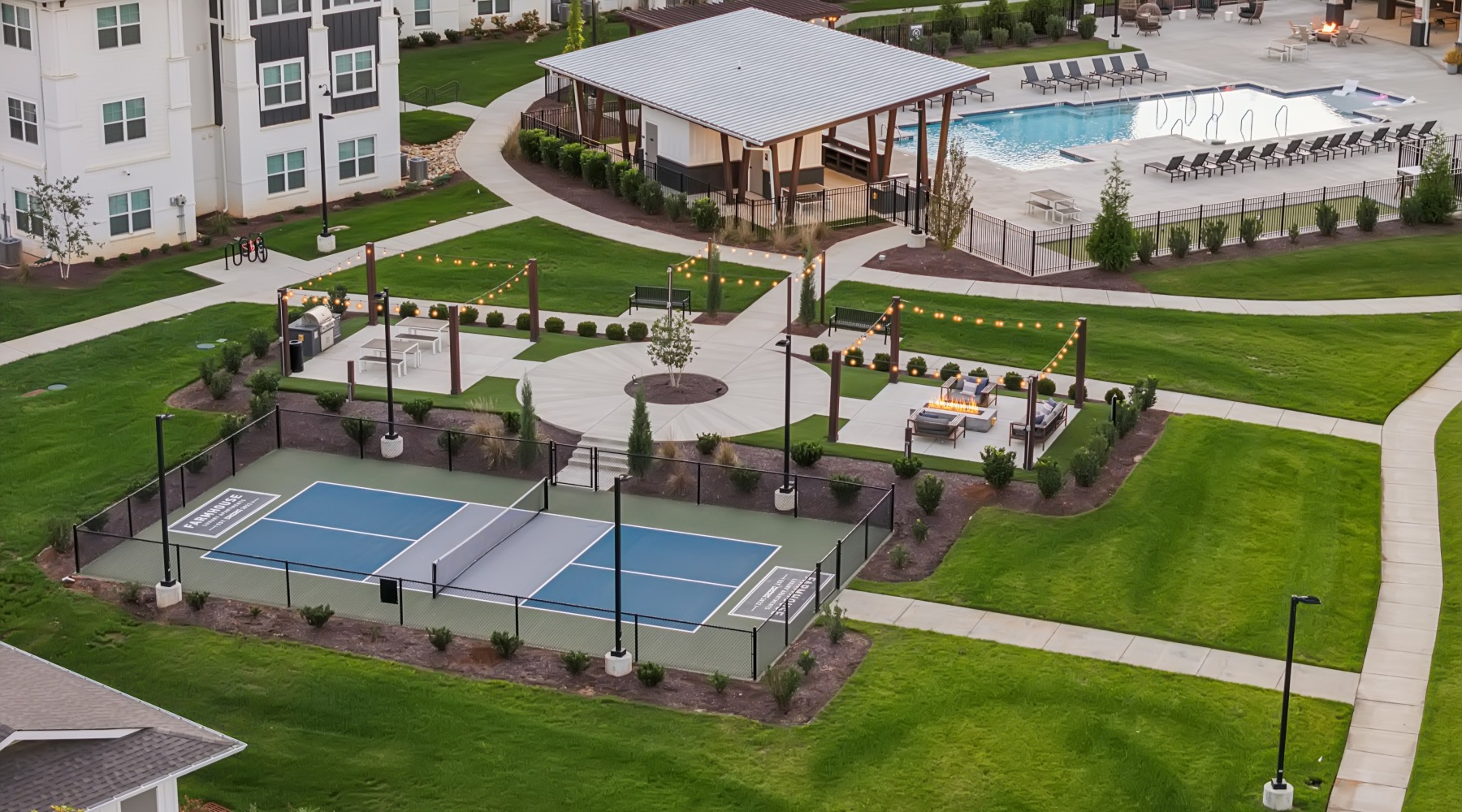 Lush landscaped courtyard  Work Hard. Unwind Easy.