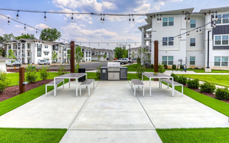 a courtyard with tables and chairs