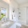 Bathroom with a window, and plant on the counter