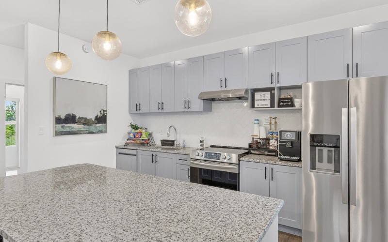 kitchen with grey cabinets and large island