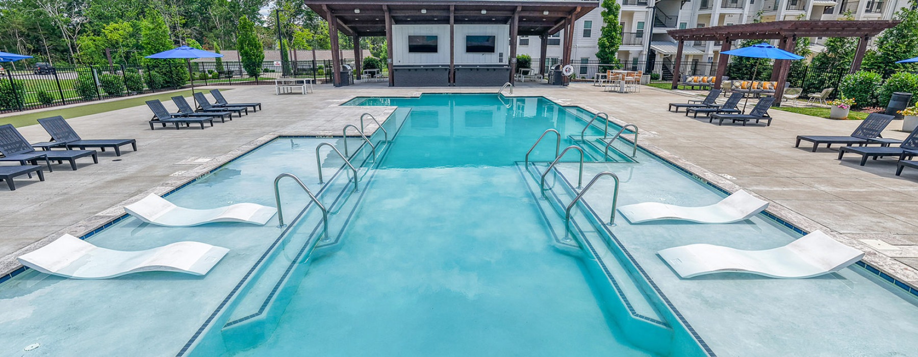 pool with lounge seating inside the pool